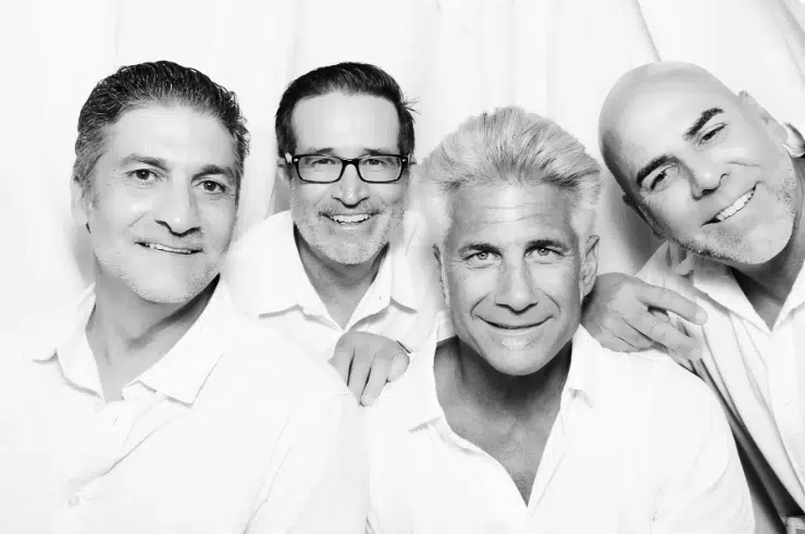 Glam photo booth at Fresno private party with white backdrop.