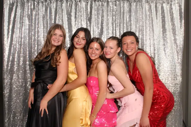 Open air photo booth at Fresno private party with white sequin backdrop.