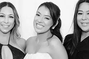Happy client glam photo booth in Fresno wedding with white sequin backdrop 200x300 1